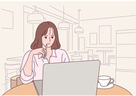 A woman is sitting in a cafe and working on a laptop.のイラスト素材