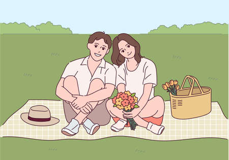 A couple is sitting romantically on a mat.のイラスト素材