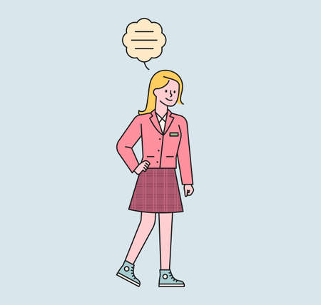 A schoolgirl is walking. There is a speech bubble above her girl's head and she is talking. flat design style minimal vector illustration.のイラスト素材
