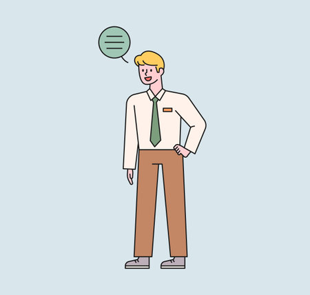 A male student in a school uniform is standing and talking. A speech bubble floats above the boy's head. flat design style minimal vector illustration.のイラスト素材