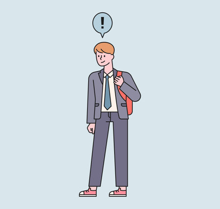 A male student with a backpack is standing. An exclamation point floats above the boy's head. flat design style minimal vectorのイラスト素材