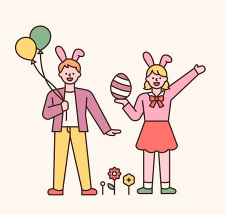 Easter characters. Boys and girls in rabbit headbands. They are holding balloons and Easter eggs in their hands. flat design style minimal vector illustration.のイラスト素材