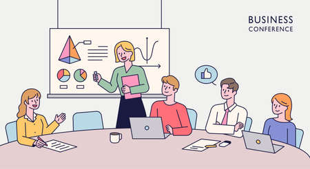 Team members are sitting together at a table and having an idea meeting. One person is standing up and giving a presentation. flat design style minimal vector illustration.のイラスト素材
