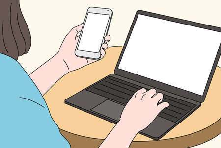 A woman is holding a smartphone in one hand and working on a laptop in the other. hand drawn style vector design illustrations.のイラスト素材