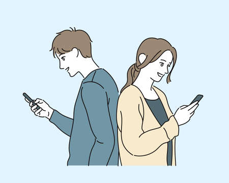 Casual style man and woman are looking at cell phones. hand drawn style vector design illustrations.のイラスト素材