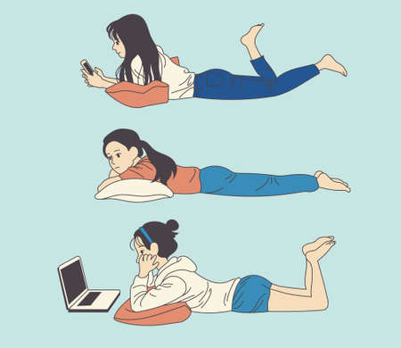 The girl is lying on a cushion and looking at her cell phone or playing a computer. hand drawn style vector design illustrations.のイラスト素材