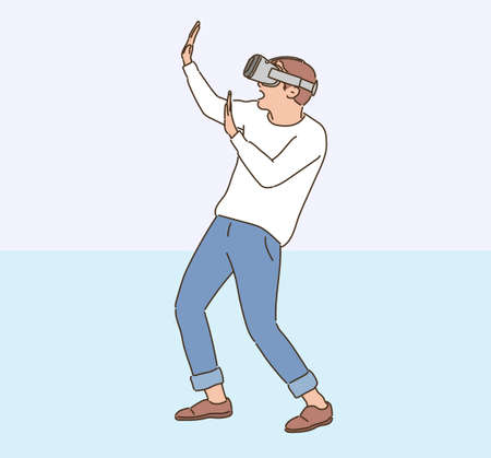 A man is wearing VR glasses and making a surprised gesture. hand drawn style vector design illustrations.のイラスト素材