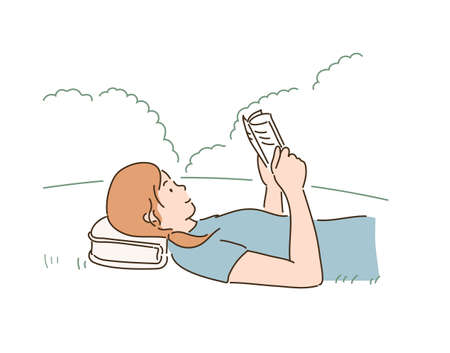 A woman is lying in the park and reading a book. hand drawn style vector design illustrations.のイラスト素材