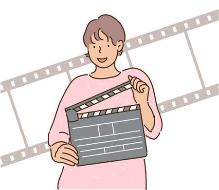 A woman is holding a clapperboard. hand drawn style vector design illustrations.のイラスト素材