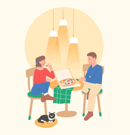 A couple is sitting comfortably and eating pizza. A cat is sitting under your feet flat design style vector illustration.のイラスト素材