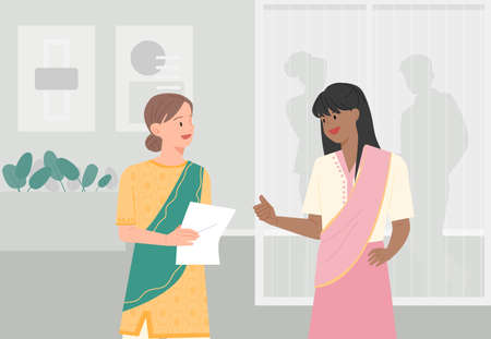 A business woman in traditional Indian attire is having a conversation. office background. flat design style vector illustration.のイラスト素材