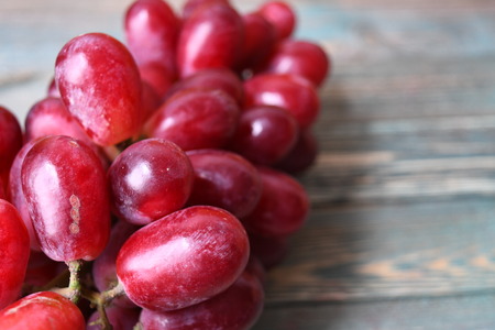 Red grape on the wood tableの写真素材