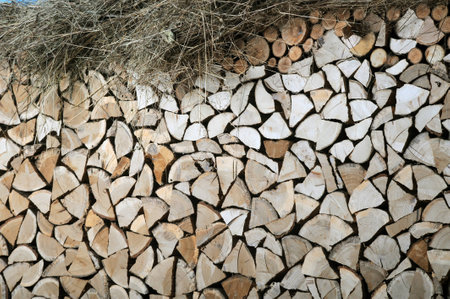  logs put together on a wallの写真素材