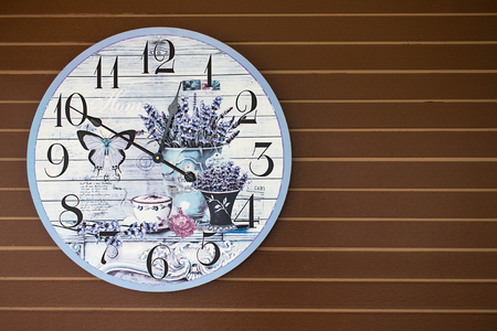 Fancy clock decorated on wooden wallの写真素材