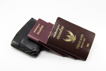 thai passport with wallet on whiteの写真素材