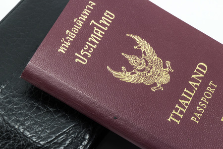 thai passport with wallet on whiteの写真素材