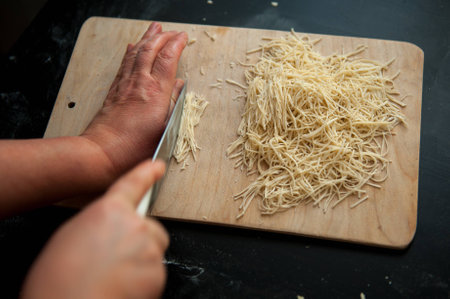 the chef cut home-made noodlesの写真素材