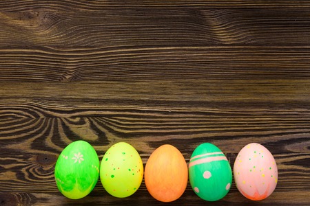 Easter eggs on wooden background, colorful, bright
