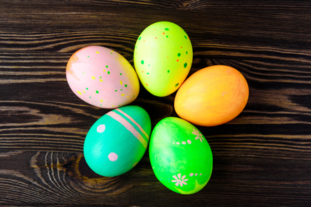 Easter eggs on wooden background, colorful, brightの写真素材