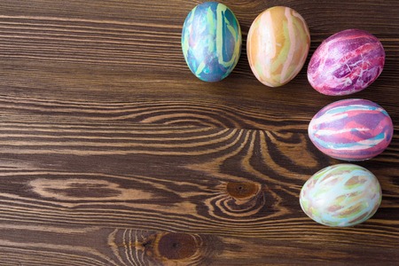 Easter eggs on wooden background, colorful, brightの写真素材