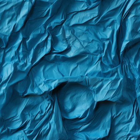 Blue crumpled paper as a background. Close-up.の素材