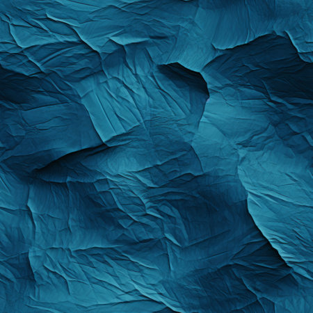 abstract blue background with crumpled paper texture for design.の素材