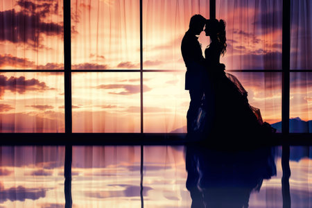 Silhouette of a bride and groom on the background of the windowの素材