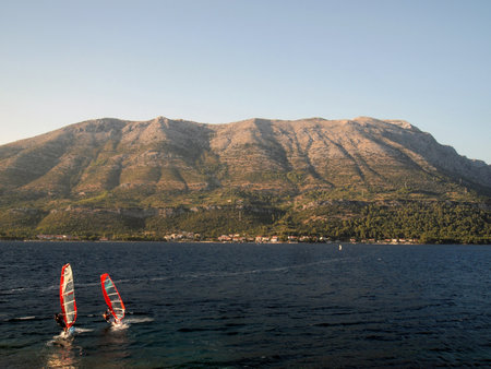 Hills in Croatia on the Peljesac peninsula with two surfers の写真素材