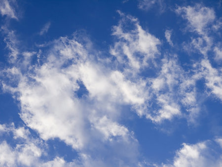 White clouds in the summer afternoon skyの写真素材