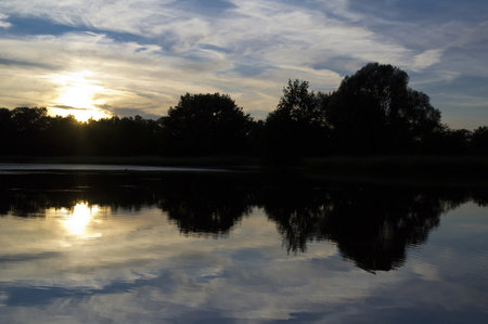 Sunset over the lake in Czech republicの写真素材