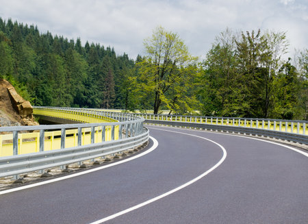 Asphalt twisty mountain road in hills in Slovakiaの写真素材