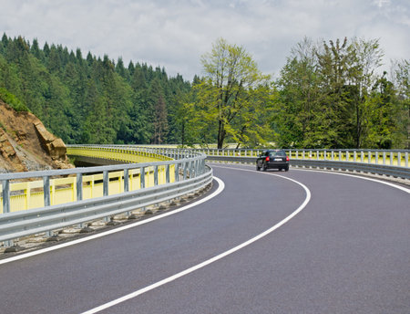 Asphalt twisty mountain road in hills in Slovakiaの写真素材