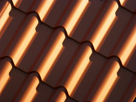 New red roofing from stainless metal plateの写真素材