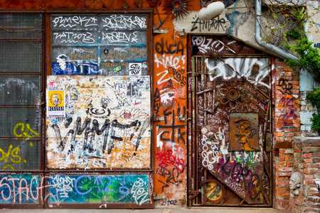 LJUBLJANA, SLOVENIA - APRIL 17  Graffitti on a wall and door in squat located in Metelkova street in Ljubljana, Slovenia on April 17, 2014 のeditorial素材