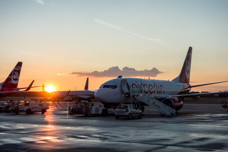 BERLIN, GERMANY - JUNE 26: Boeing 737-700 (737-7K5 D-AHXJ) of AirBerlin company in Berlin Tegel (TXL) airport during sunset. The image was taken on June 26,2014.のeditorial素材