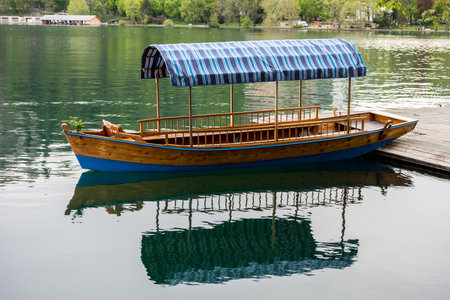Tourist boat on a shore of Bled lake in Slovenia