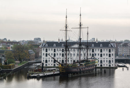 Replica of a wooden ship in front of museum in Amsterdamのeditorial素材