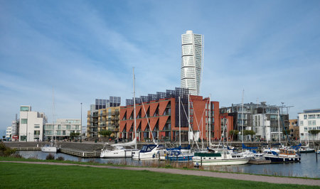MALMO, SWEDEN - OCTOBER 26: Cityscape of Malmo harbour with luxury yachts and Turning Torso in the background. The image was taken on October 26, 2014.のeditorial素材