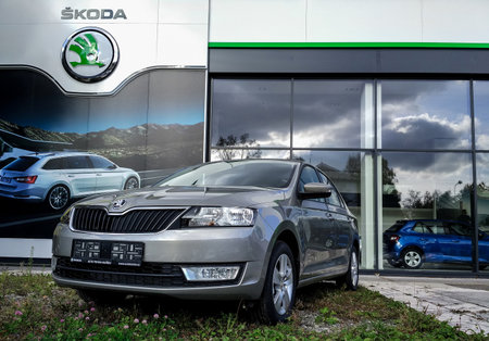 HAVIROV, CZECH REPUBLIC - NOVEMBER 4: Grey Skoda Rapid liftback car in front of the car seller showroom in Havirov, Czech Republic on November 4, 2016.のeditorial素材