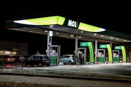 OSTRAVA, CZECH REPUBLIC - JANUARY 16, 2018: MOL gas station during night in Ostrava, Czech republic. The company has replace Agip gas stations. The image was taken on January 16, 2018.のeditorial素材