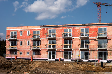 OSTRAVA, CZECH REPUBLIC - APRIL 2, 2018: Construction zone of modern apartments built using red bricks in Ostrava city. The image was taken on April 2, 2018.のeditorial素材