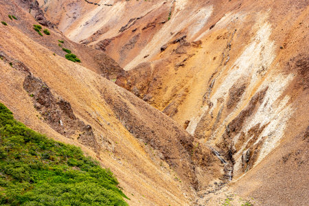 Steep ravine with red hills in Lonsoraefi in Iceland, Europeの写真素材
