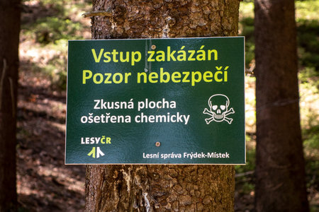 KRASNA, CZECH REPUBLIC - APRIL 21, 2018: Warning in forests in Beskydy Mountains prohibiting entry because of dangers of chemical treatment that was applied. The image was taken on April 21, 2018.のeditorial素材