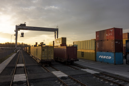 SENOV U OSTRAVY, CZECH REPUBLIC - APRIL 11, 2018. Container terminal for unloading goods from trains to trucks in Senov u Ostravy during beautiful sunrise. The image was taken on April 11, 2018.のeditorial素材