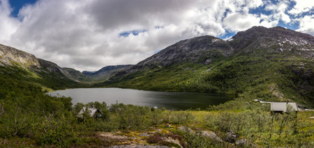 Panorama of Grytingsvatnet lake near Kinsarvik town in Norway in cloudy weatherの写真素材
