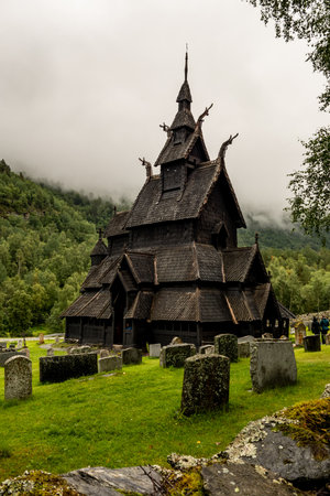 Borgund stave church (stavkyrkje) in Norway in misty cloudy weather in a portrait orientationの写真素材