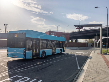 OSTRAVA, CZECH REPUBLIC - APRIL 24, 2019: Modern ecological electric bus Ekova Electron 12 of the DPO company waiting near Svinovske Mosty close to charging station in a backlight with HDR effect.のeditorial素材
