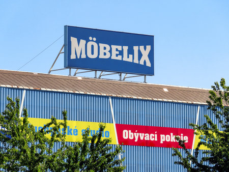 OSTRAVA, CZECH REPUBLIC- JUNE 2, 2019: The exterior of Mobelix furniture store in Ostrava with a large banner showing the type of furnitures which are sold here in Czech language.のeditorial素材