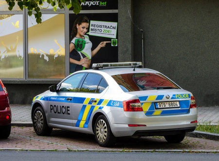 OSTRAVA, CZECH REPUBLIC - JULY 24, 2019: Skoda Octavia police car of the Policie CR (Czech Republic Police) parked in front of the Kajot Bet gamling store in order to prevent criminality.のeditorial素材
