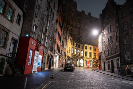 EDINBURGH, UNITED KINGDOM - JULY 29, 2019: Famous West Bow street with a lot of shops in Edinburgh during the nightのeditorial素材